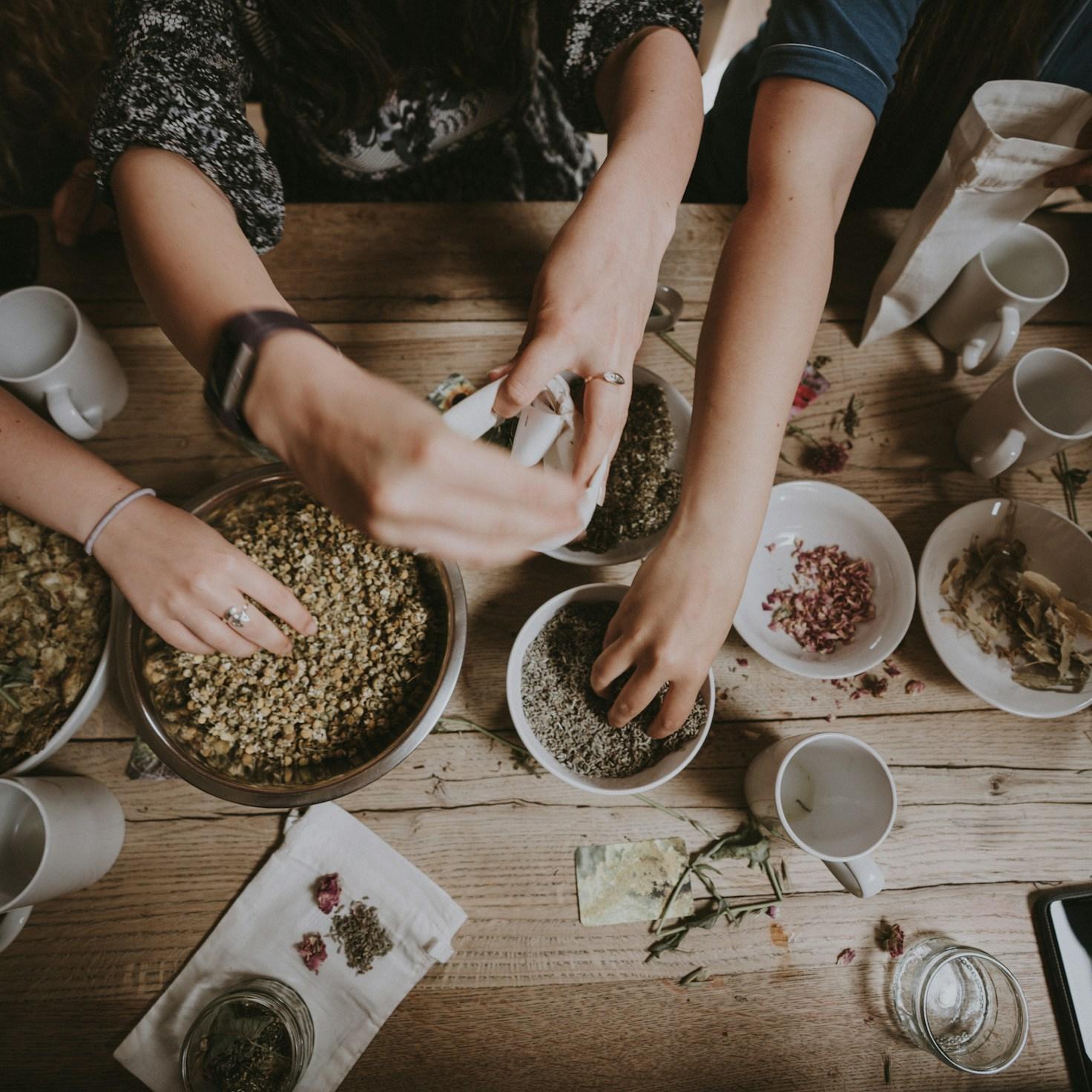 Community members collaborating in a contemporary kitchen, sharing recipes and cooking techniques